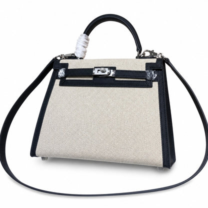 Top Selling Kelly 25 Bag With Outside Stitching, Made Of Textured Canvas & Soft Swift Leather Patchwork, Classic Black Silver Hardware Combination, Stunning Mixed Material Texture Dimensions: Length 25 * Width 10 * Height 18cm