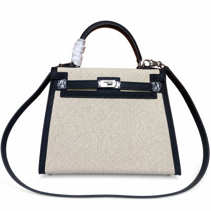 Top Selling Kelly 25 Bag With Outside Stitching, Made Of Textured Canvas & Soft Swift Leather Patchwork, Classic Black Silver Hardware Combination, Stunning Mixed Material Texture Dimensions: Length 25 * Width 10 * Height 18cm