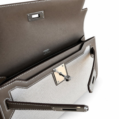 Kelly Depeches 25 clutch, canvas and swift leather (with additional shoulder strap), can be carried cross-body, can be carried by hand or on the wrist, daily needs, seamless switching between business